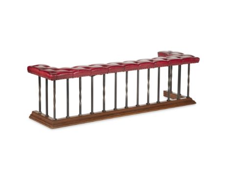 STEEL AND LEATHER UPHOLSTERED CLUB FENDER  the red leather button upholstered seat rail raised on twisted and straight suppor