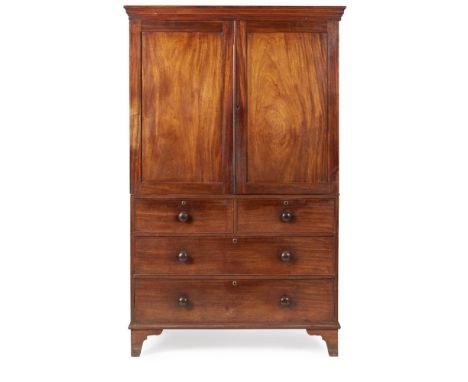 EARLY VICTORIAN MAHOGANY LINEN PRESS  MID 19TH CENTURY   the moulded cornice above a pair of panel cupboard doors enclosing s
