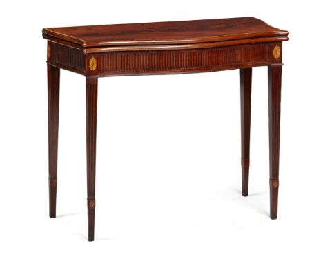 GEORGE III MAHOGANY SERPENTINE FOLD-OVER CARD TABLE  18TH CENTURY   the crossbanded serpentine fold-over top above a fluted f