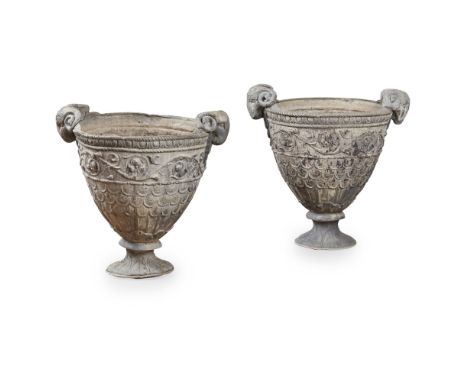 PAIR OF LEAD GARDEN URNS  EARLY 20TH CENTURY   of deep U shape with rams' mask handles, the sides cast in relief with foliate