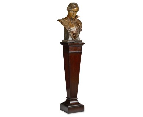 GOLDSCHEIDER BUST OF HUSSAR  EARLY 19TH CENTURY   the polychrome and gilt bust with stamped marks; together with a MAHOGANY S