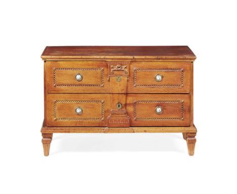 FRENCH PROVINCIAL FRUITWOOD COMMODE  LATE 18TH CENTURY   the rectangular top over two long drawers with guilloche carving and