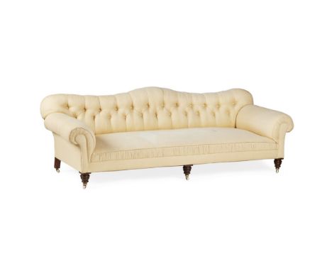 LARGE VICTORIAN BUTTON UPHOLSTERED SOFA  MID 19TH CENTURY   the serpentine button tufted back above a deep seat and wide scro