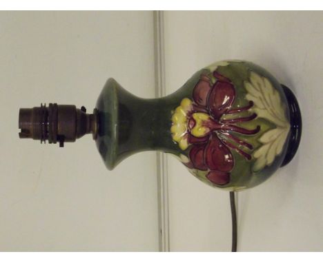 Moorcroft table lamp, baluster form and in the Columbine pattern against a green ground, impressed marks, height 23cm