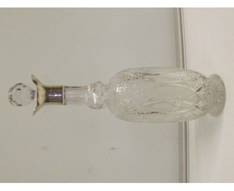 Edwardian silver mounted cut glass decanter, London, 1902, Betjemann Brothers, height 34cm.
Note; very minor flaw to undersid