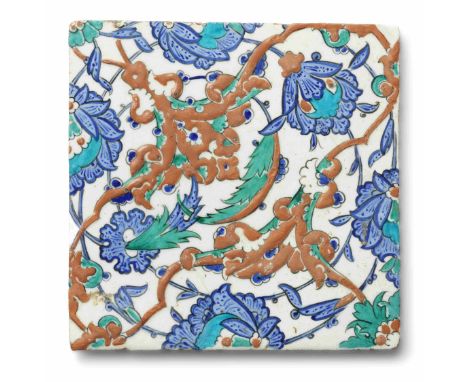An Iznik pottery tile  Turkey, circa 1570of square form, decorated in raised red, cobalt blue, turquoise and green with black