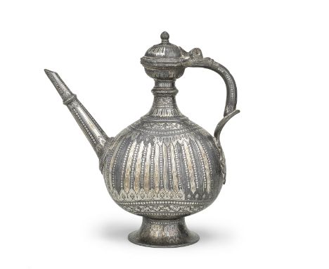 A silver-inlaid alloy bidri ewer India, 17th/ 18th Centuryof flattened bulbous form on a flared foot, the tapering neck with 