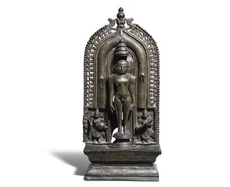 A Jain brass shrine Karnataka, 17th Centurythe naked Tirthankara with broad shoulders and long arms to the sides, flanked by 