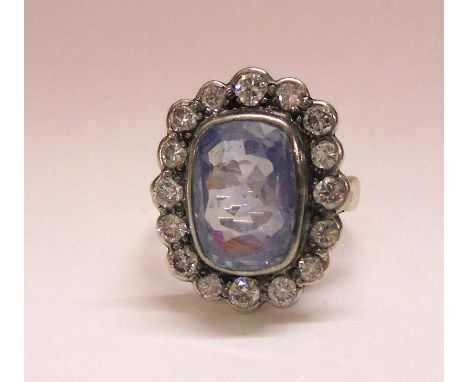 Unmarked Yellow Metal Ladies Diamond & Sapphire Ring, pale facet cut Ceylon sapphire central stone surrounded by 16 brilliant