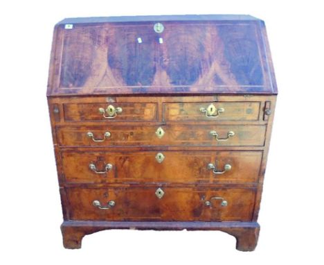Early C18th George I Walnut Bureau with 3 long graduated cock beaded oak lined drawers & 2 short drawers all with herringbone