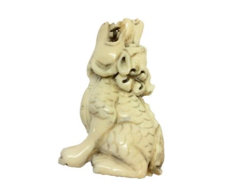 Carved Ivory Netsuke Howling Dog of Fo, signed to foot 