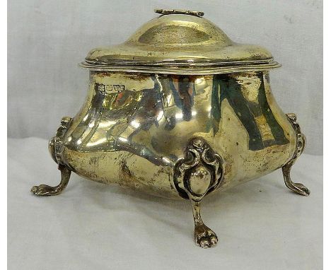 Unusual Quatrefoil Caddy circa 1905, on animal paw supports, cartouche shaped terminals, hinged lid, small handle 