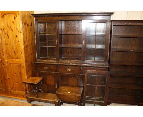 A small oak drop leaf coffee table; an oak oblong table and an inlaid table raised on bobbin turned supports