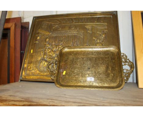 An Indian brass twin handled tray together with a brass embossed firescreen panel