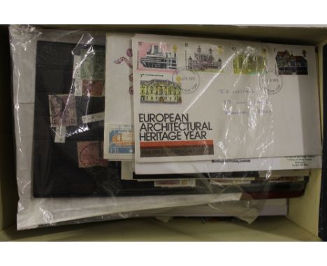 A box containing stamps and first day covers