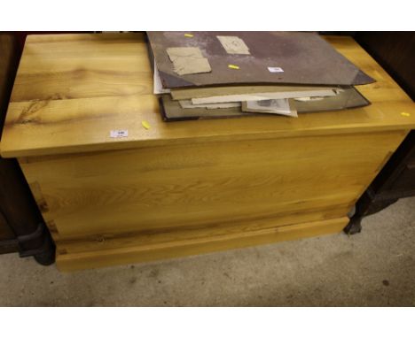 A light oak blanket box