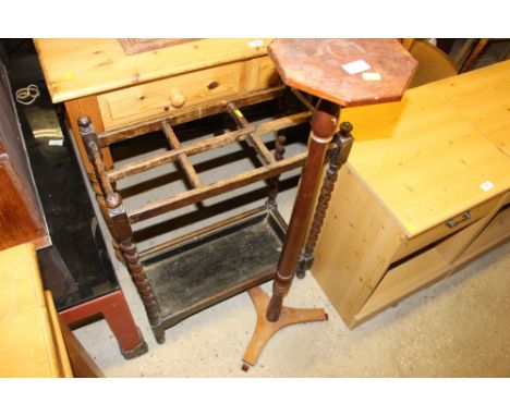 A mahogany plant stand; and an oak stick stand 