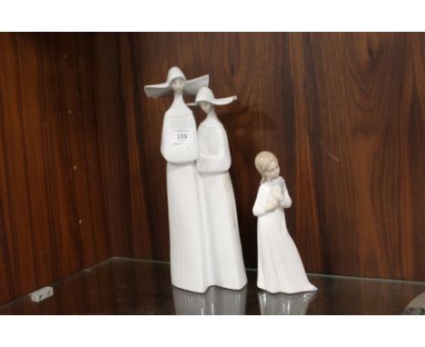 A LARGE LLADRO FIGURE GROUP OF TWO NUNS TOGETHER WITH A SMALLER NAO FIGURE OF A GIRL WITH A PUPPY