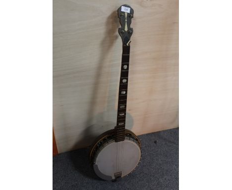 A VINTAGE WOODEN BANJO, WITH LOSSES