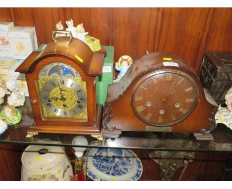 A REPRODUCTION HERMLE MOON PHASE MANTEL CLOCK TOGETHER WITH A WALNUT EXAMPLE