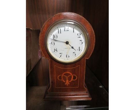 AN EDWARDIAN MAHOGANY INLAID SMALL MANTEL CLOCK, with U.S.A. eight day movement, H 22 cm