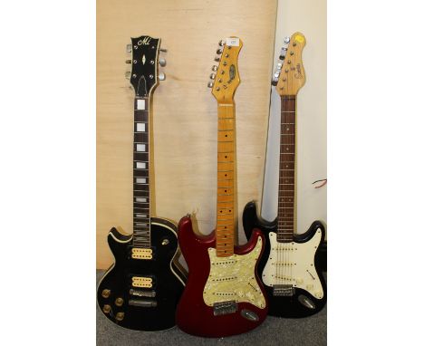 THREE ELECTRIC GUITARS, COMPRISING A RED STAGG EXAMPLE, A BLACK ENCORE EXAMPLE AND A LEFT HANDED M.I. LES PAUL SHAPE EXAMPLE,
