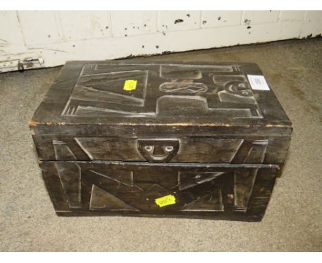 A VINTAGE WOODEN BOX DECORATED WITH CARVED FIGURES