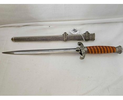 A WW II GERMAN ARMY DAGGER. NO MAKERS MARK, ORANGE SPIRAL GRIP WITH POSSIBLE CRACK. PLATING BEGINNING TO LIFT ALL SCREWS PRES