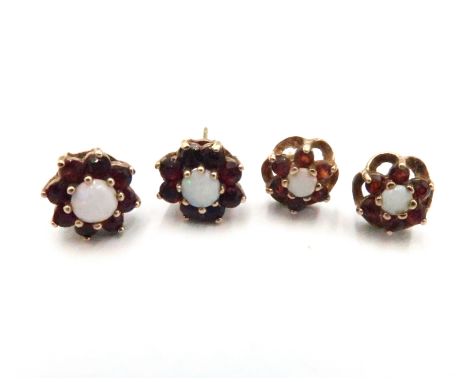 Two pairs of opal and garnet ear studs. With marks indicating 9ct gold. Butterfly fittings missing. Weight 3.23 grams