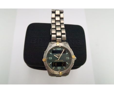 A gentleman's Breitling Aerospace, titanium quartz wristwatch, with digital and analogue green dial, circa 1998.