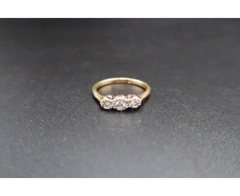 An 18ct gold (hallmarked) three stone diamond illusion set ring size J/K - weight approx 2.1 grams