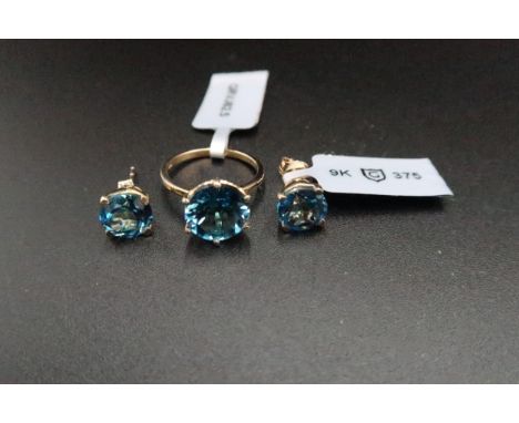 A 9ct gold topaz single stone ring. Size K. Together with matching ear studs. Weight 4.80 grams