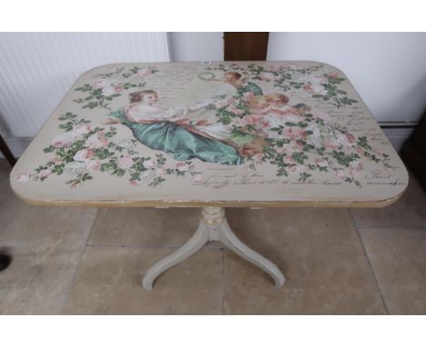 An overpainted tilt top table decorated with script, Paris Montmartre cherubs and roses, gilt highlights to tripod base - Wid