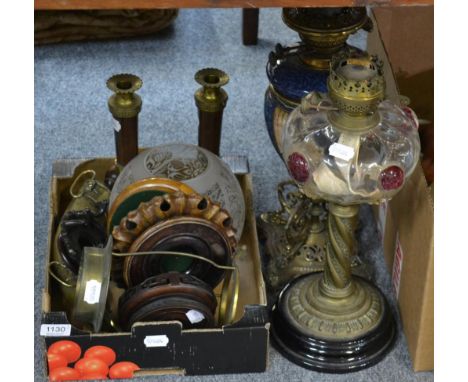 A brass oil lamp with glass reservoir, another oil lamp, a pair of brass and marble candlesticks, a horn powder flask and fou