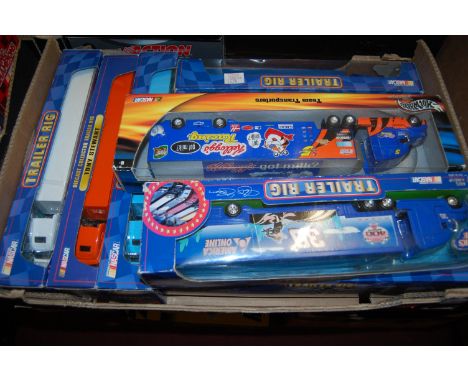 Ten various boxed Winners circle and Hotwheels Nascar team transporter tractor units and trailers all in the original window 