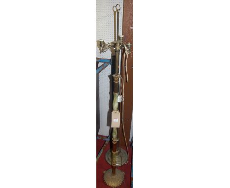 A gilt brass three branch standard lamp, together with a similar onyx and brass example (2)