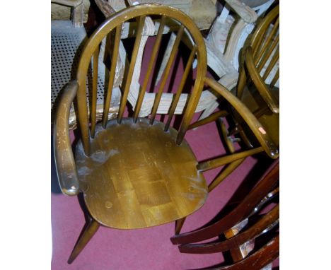 A set of six Ercol dark elm stick back kitchen chairs (4+2)