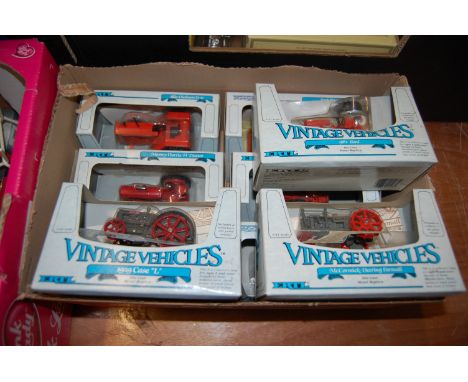 Two boxes containing a quantity of modern release diecast ERTL, Matchbox Models of Yesteryear and Vanguards examples to inclu