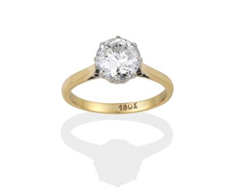 the round brilliant cut diamond in a white claw setting, to a yellow tapered shoulder plain polished shank, estimated diamond