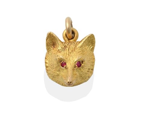 the textured yellow fox mask with round cut ruby eyes, suspended from a plain polished balelength 2.0cmCondition report: The 