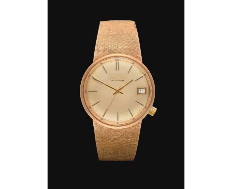 tuning fork battery driven movement, champagne coloured dial with baton markers, date aperture, Bulova crown at 4, screw back