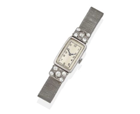 the rectangular dial with Arabic numerals, with pierced rectangular diamond plaque shoulders, each with old cut diamonds in w