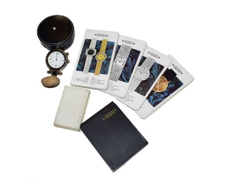 the first: quartz battery driven movement, white dial with Arabic numerals, central alarm disc, travel case with a hinged str