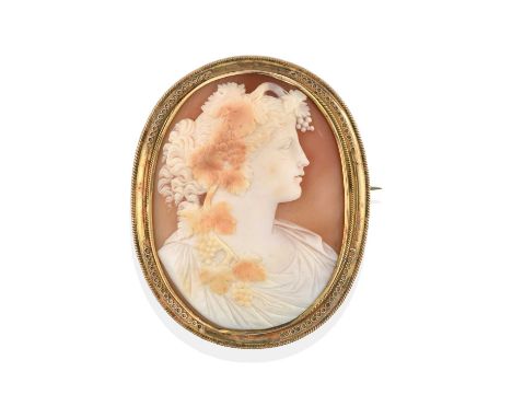 the shell cameo brooch depicting Bacchus, within a yellow oval frame with ropework decoration; a cameo stickpin depicting a f