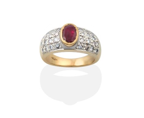 the oval cut ruby in a yellow rubbed over setting, flanked by white pavé set round brilliant cut diamonds, to a yellow plain 
