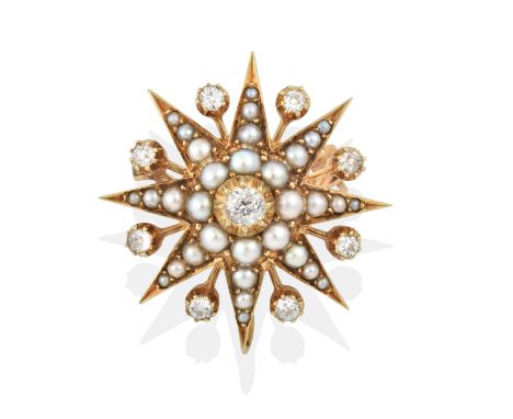 the central old cut diamond within a border of split pearls, to eight radial points set throughout with graduated split pearl