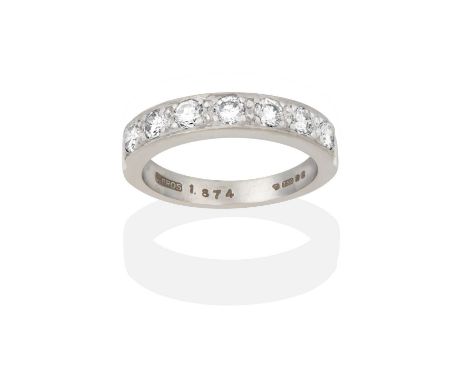 the seven round brilliant cut diamonds in claw and channel settings, to a plain polished shank, total estimated diamond weigh