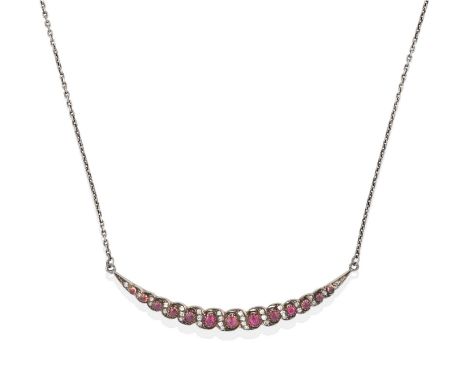 the crescent set throughout with graduated round cut synthetic rubies spaced by old cut and rose cut diamonds, in white claw 