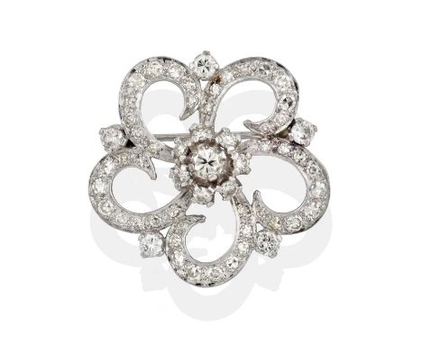 realistically modelled as a floral motif, the central cluster of round brilliant cut diamonds to an openwork border set throu