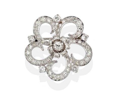 realistically modelled as a floral motif, the central cluster of round brilliant cut diamonds to an openwork border set throu